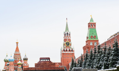Fototapeta premium Spasskaya Tower and the Cathedral of Vasily the Blessed (Saint Basil's Cathedral) on Red square. Winter day after snowfall. Moscow. Russia