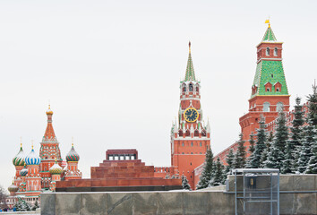 Fototapeta premium Spasskaya Tower and the Cathedral of Vasily the Blessed (Saint Basil's Cathedral) on Red square. Winter day after snowfall. Moscow. Russia