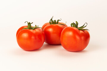 3 tomatoes on a white background