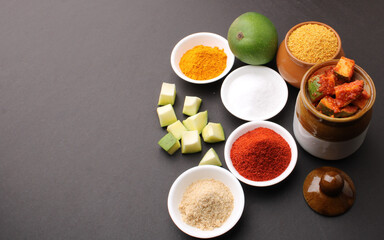 Obraz na płótnie Canvas Homemade Mango Pickle or aam ka achar Kairi Loncha with Ingredients.