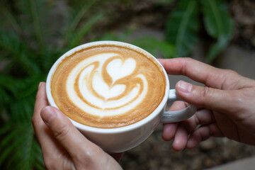 Handcraft of hot milk coffee cup