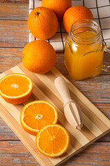 Orange juice in a glass jar on the cutting board