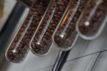 Close up Coffee bean in the glass tube Selective focus