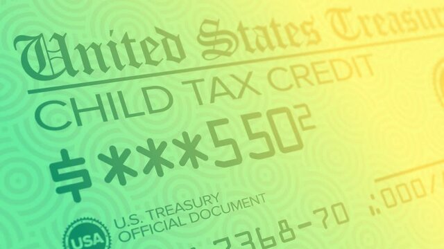 A stylized background animation of a fictional United States monthly child tax credit check. The Biden administration pushed for stimulus checks during the COVID-19 pandemic.  	