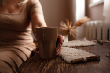 Close-up of woman hand with cup