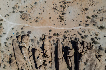 Aerial picture of a gravel road around the mountains of spitzkoppe