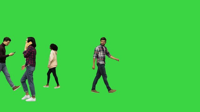 People walking in the streets, passing by Urban life concept on a Green Screen, Chroma Key.