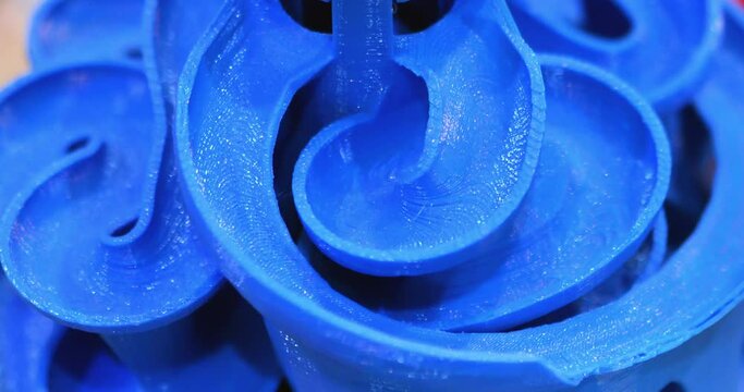 Object printed with plastic of red color on a 3d printer.