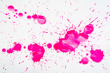 Pink blots and spots on a white background.