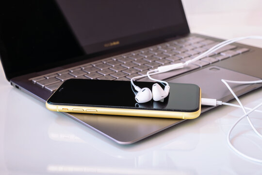 8.20.2019 - Kyiv, Ukraine: Asus zenbook with iphone xr and headphone