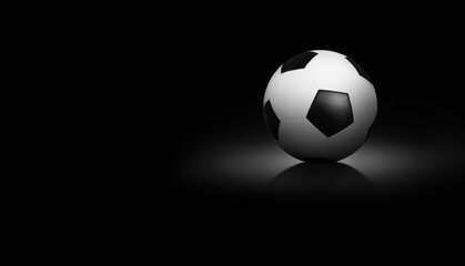 Fototapeta na wymiar Soccer ball on black background.