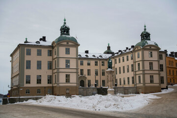 Fototapeta na wymiar Old court house on the island Riddarholmen a snowy winter day in Stockholm 