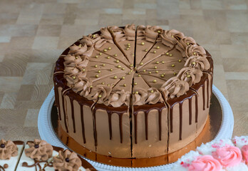 delicious sweet chocolate cake with cream on a table in a cafe