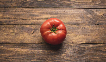 natural tomato on top of wooden table