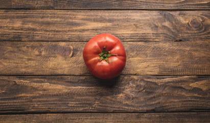 natural tomato on top of wooden table