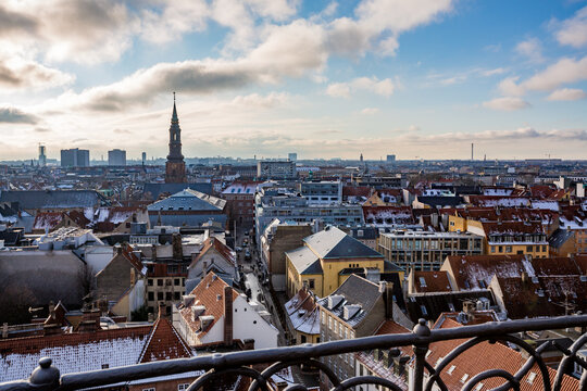 Cityscape, amazing view over the city of Copenhagen, Denmark. Winter cloudy picturesque scene with roofs and buildings. Picture taken from Round Tower