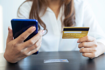 Women hand using mobile smartphone payments and credit card for online shopping mobile banking, Online shopping, digital banking, internet payment concept.