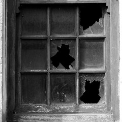 old wooden window with broken glass.