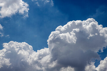 White clouds against blue sky background
