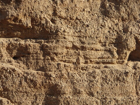 Deposition Strata in a Canyon Wash showing the Hydrology History of the River Bed Looking at the Size of the Layer Materials