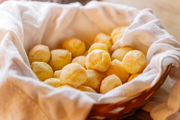 basket full of golden pão de queijo snack