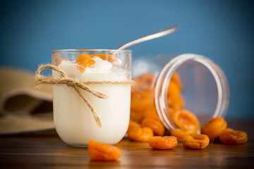 homemade sweet yogurt in a glass with dried apricots