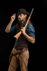 Cowboy with guns. Studio shooting