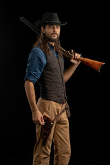 Fototapeta premium Cowboy with guns. Studio shooting