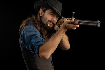 Cowboy with guns. Studio shooting