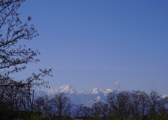 snowy mountains with blue sky in Nagano Japan