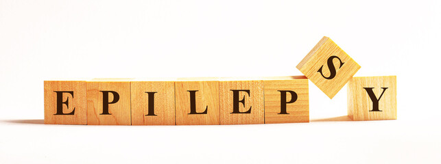On a light background, wooden cubes with the text EPILEPSY