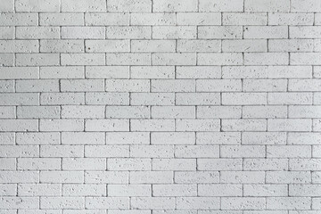 Loft styled white brick wall. Surface white wall of stone wall gray tones for use as background. Brick room, interior texture, wall background. Texture of whitened masonry