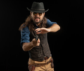 Cowboy with guns. Studio shooting