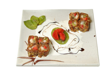 sweet sushi from fruit and berries in a plate it is isolated on a white background