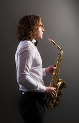 Plakat young saxophone player