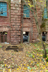 Fototapeta na wymiar Abandoned brick factory in autumn forest