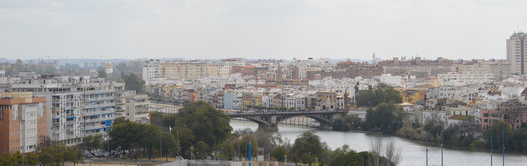 Fototapeta na wymiar Aerial view of Triana and the river Guadalquivir. Seville, Spain