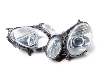 Stylish xenon right headlight of a German car - optical equipment with a lamp inside on a white...