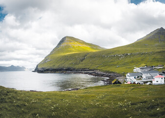Faroe islands village of Gjogv or Gjov in Danish. Sea-filled gorge on the northeast tip of the island of Eysturoy, in the Faroe Islands.