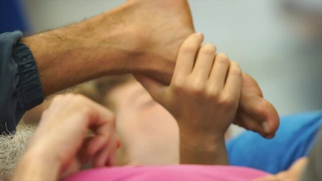 the dancers feet moving near the floor interact with the hands