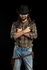 Cowboy with guns. Studio shooting