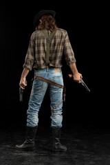 Cowboy with guns. Studio shooting