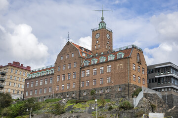 Fototapeta na wymiar Old red brick building of Navigation school (Navigationsskolan) with time ball in the tower. Gothenburg, Sweden.