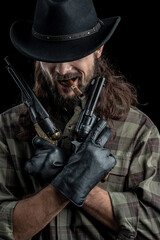 Fototapeta premium Cowboy with guns. Studio shooting