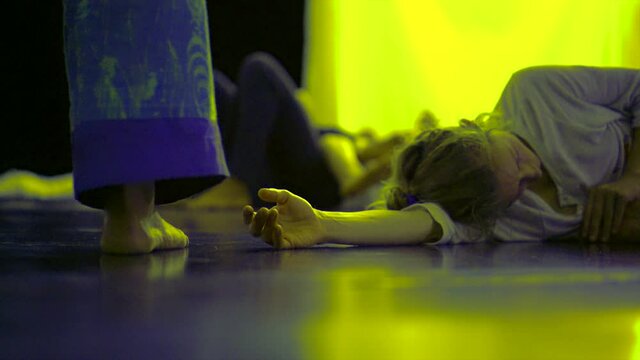the dancers feet moving near the floor interact with the hands