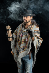 Fototapeta premium Cowboy with guns. Studio shooting