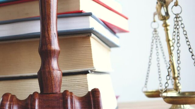 Justice legal and jurisprudence concept. Law books on lawyer desk at law firm.	
