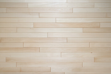 The wall is lined with neat light wooden linden planks