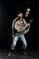Cowboy with guns. Studio shooting
