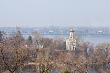 small christian church on the urban city river coast
